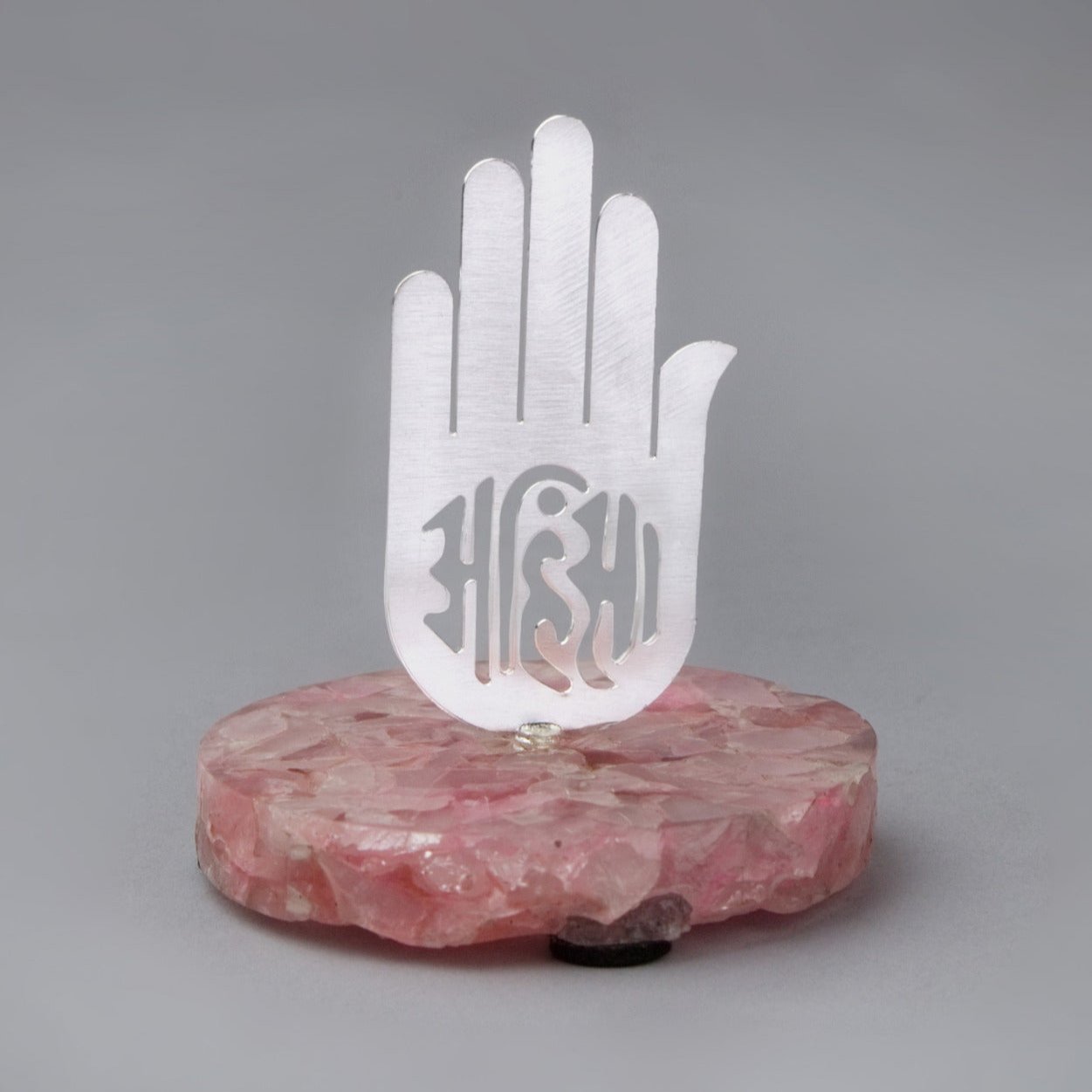 Jain cutwork on rose quartz base